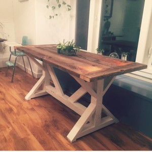 6-person Farm Style table with reclaimed barn wood top and white base made in Bend, OR.