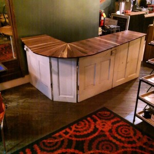 Bar top made from reclaimed walnut wood and vintage doors at the Creme Coffee House in Owensboro, Kentucky