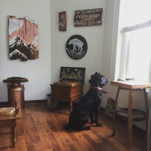 Our cane corso posing with our Reclaimed wood painted signs and furniture in Bend, Oregon
